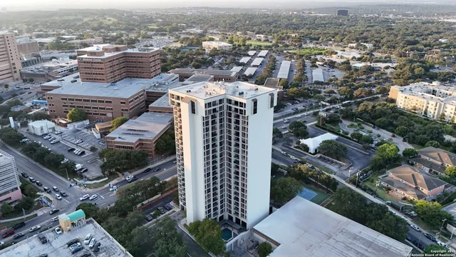 a front view of a house with plants