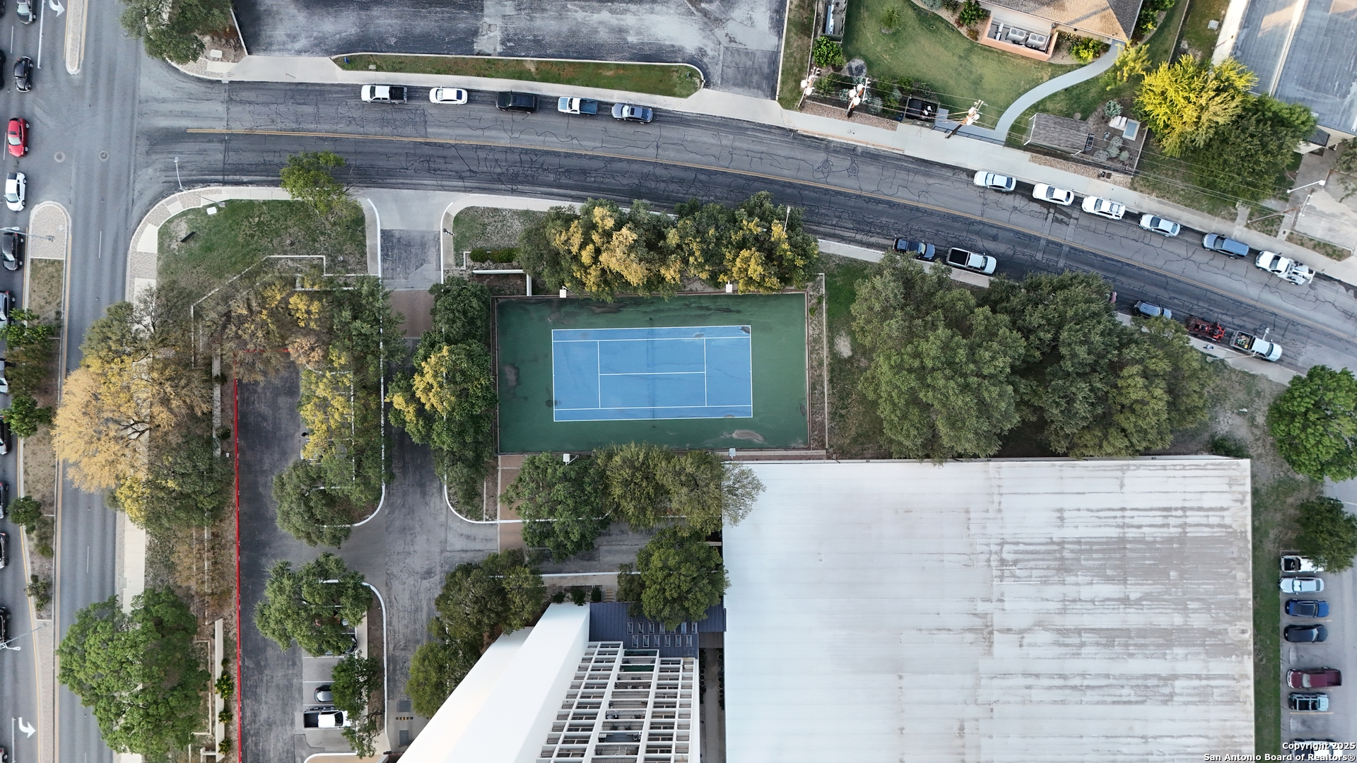 7701 Wurzbach Road, Unit 405 San Antonio, TX 78229 - Photo 40 of 42 a front view of a house with plants
