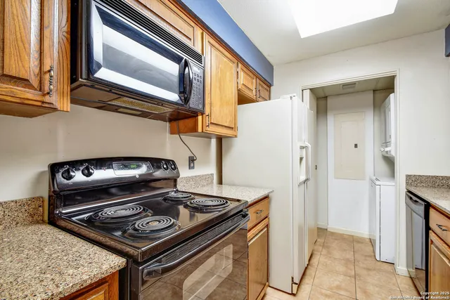 a stove top oven sitting inside of a kitchen