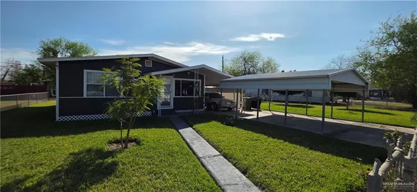 a view of a house with a yard porch and sitting area