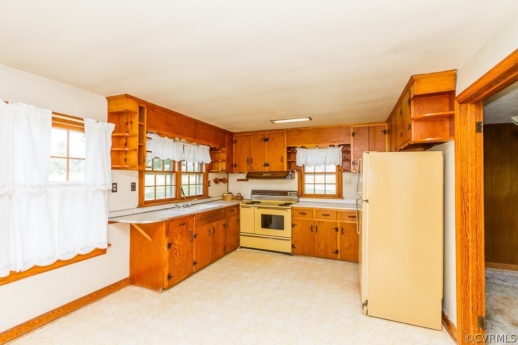 17293 Beaver Dam Road Beaverdam, VA 23015 - Photo 3 of 20 a kitchen with stainless steel appliances granite countertop a refrigerator and a stove top oven