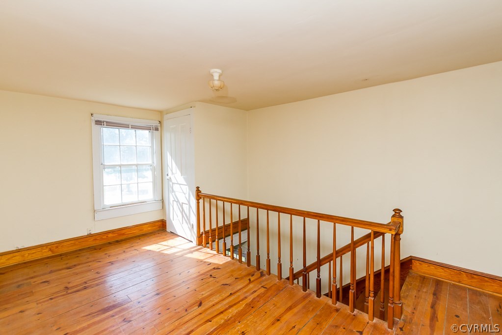 17293 Beaver Dam Road Beaverdam, VA 23015 - Photo 8 of 20 a view of a hallway with wooden floor and windows