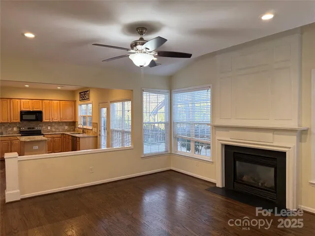 a large living room with a fireplace