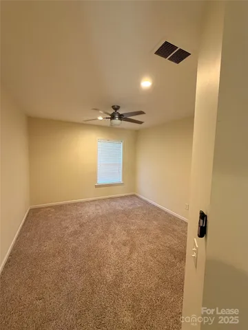 an empty room with a empty space and windows