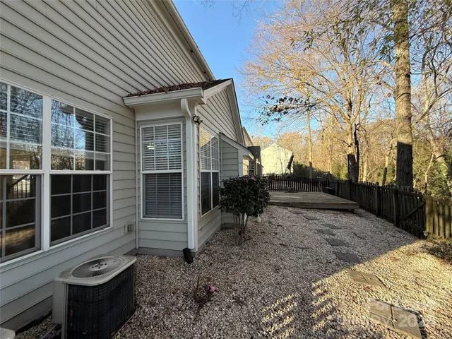 a view of a backyard with a large tree
