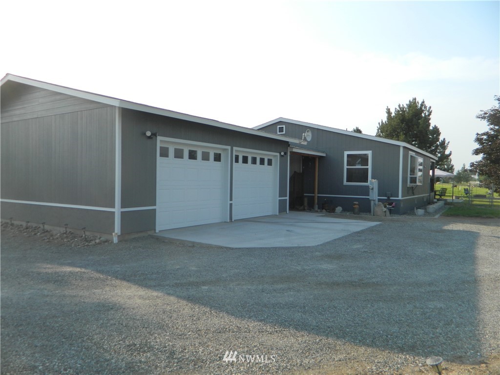 a view of house with garage