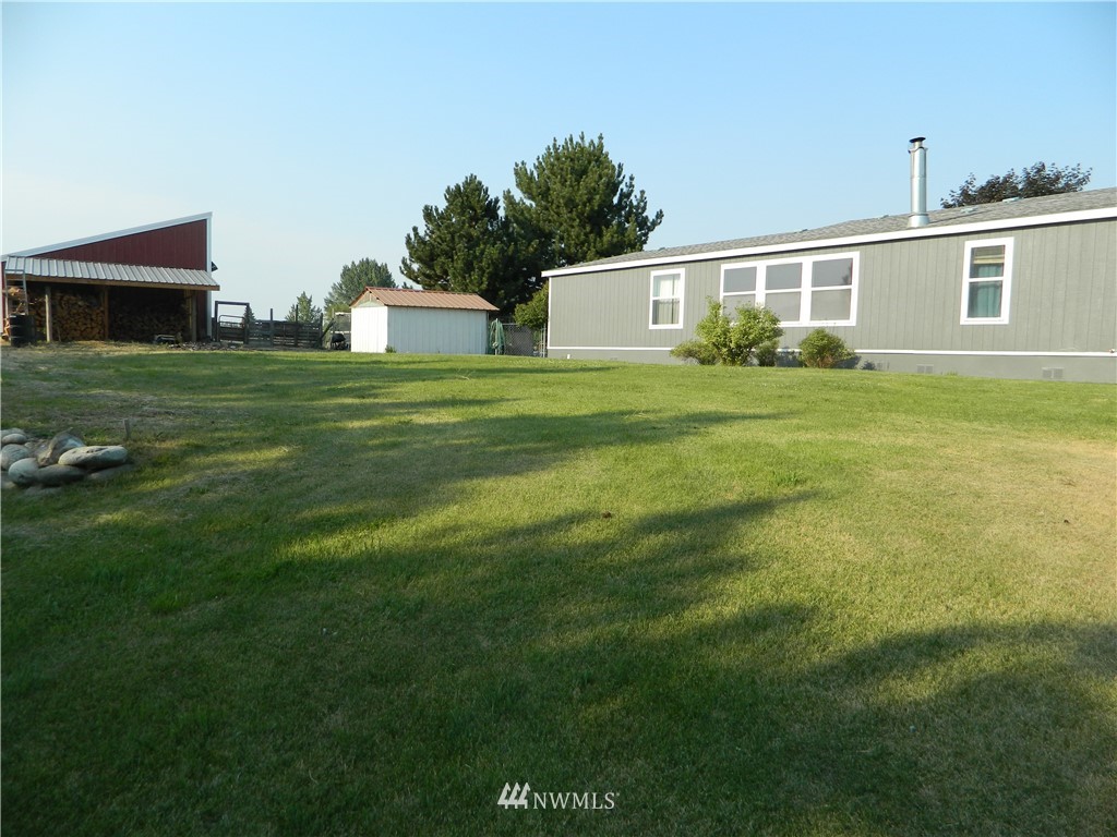 41 Miller Road Omak, WA 98841 - Photo 9 of 27 a front view of a house with a yard