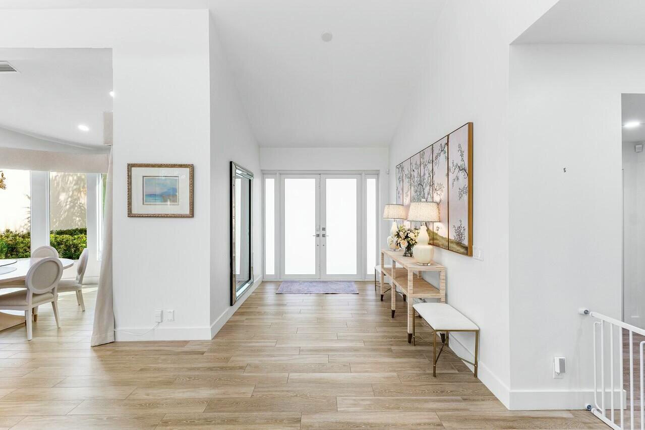4356 Kasso Circle Boca Raton, FL 33487 - Photo 12 of 72 a view of an empty room with wooden floor and a window