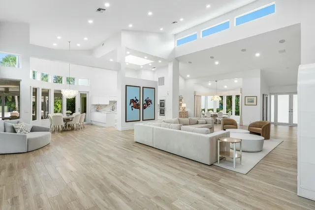 a view of a dining room with furniture wooden floor and chandelier