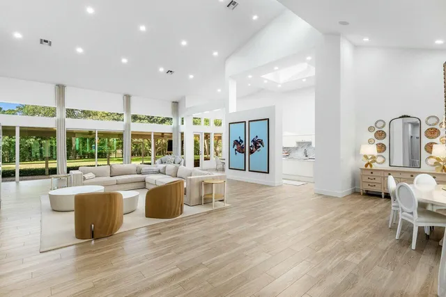 a kitchen with kitchen island wooden cabinets and refrigerator