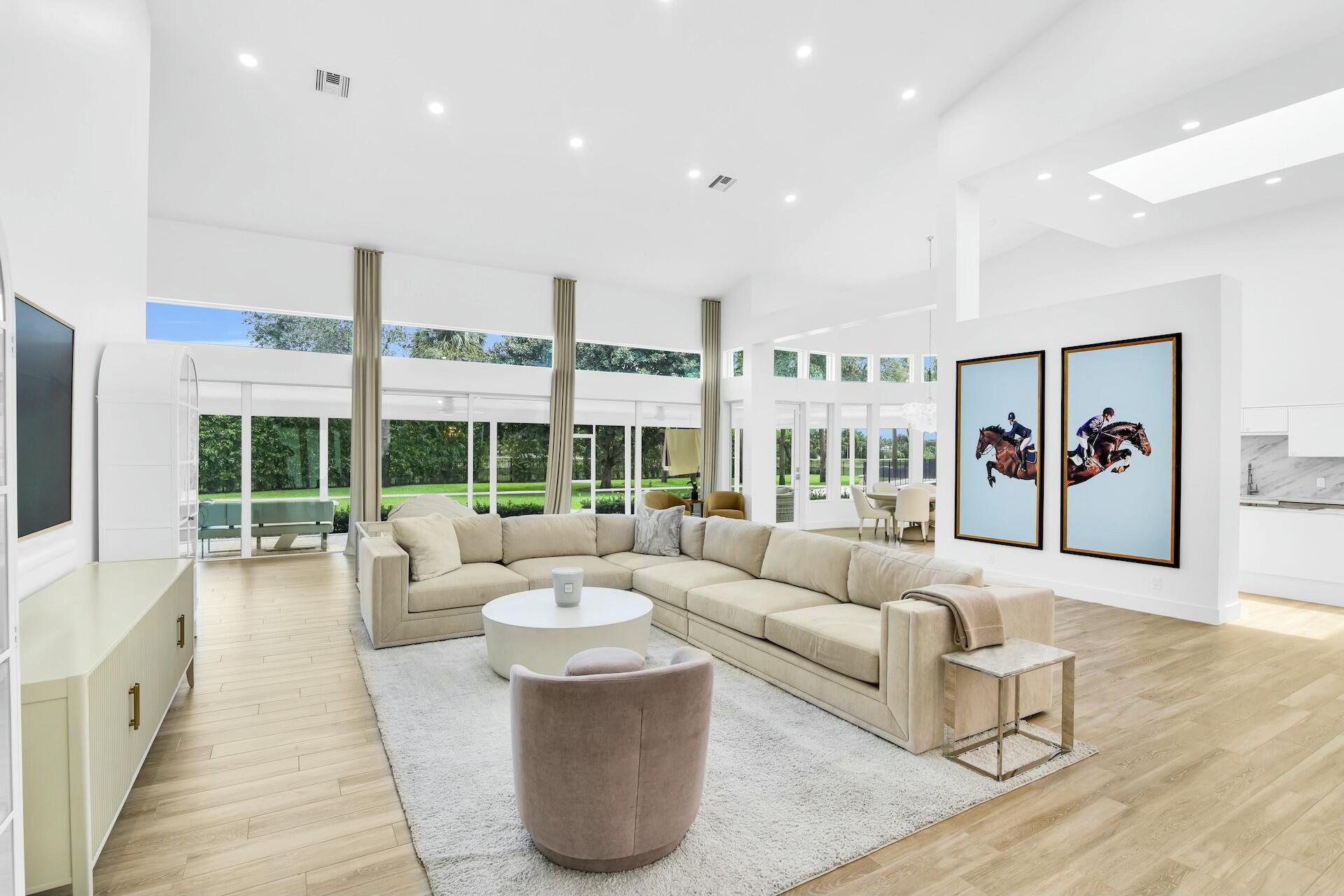 4356 Kasso Circle Boca Raton, FL 33487 - Photo 17 of 72 a living room with furniture and large windows