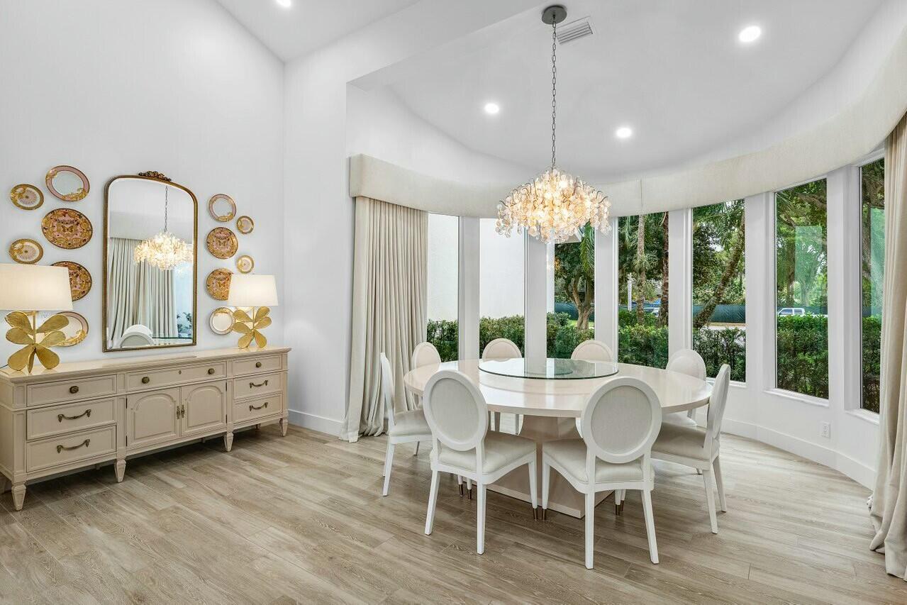 4356 Kasso Circle Boca Raton, FL 33487 - Photo 18 of 72 a view of a dining room with furniture window and wooden floor
