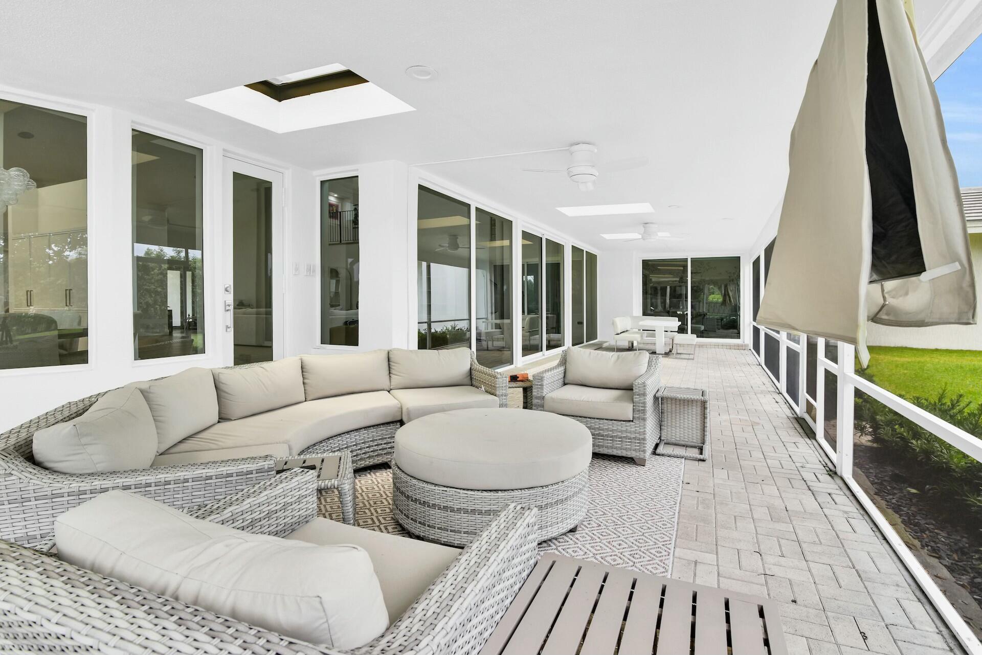 4356 Kasso Circle Boca Raton, FL 33487 - Photo 28 of 72 a living room with furniture and a large window