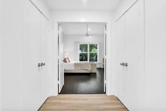 an aerial view of residential house with outdoor space and trees all around