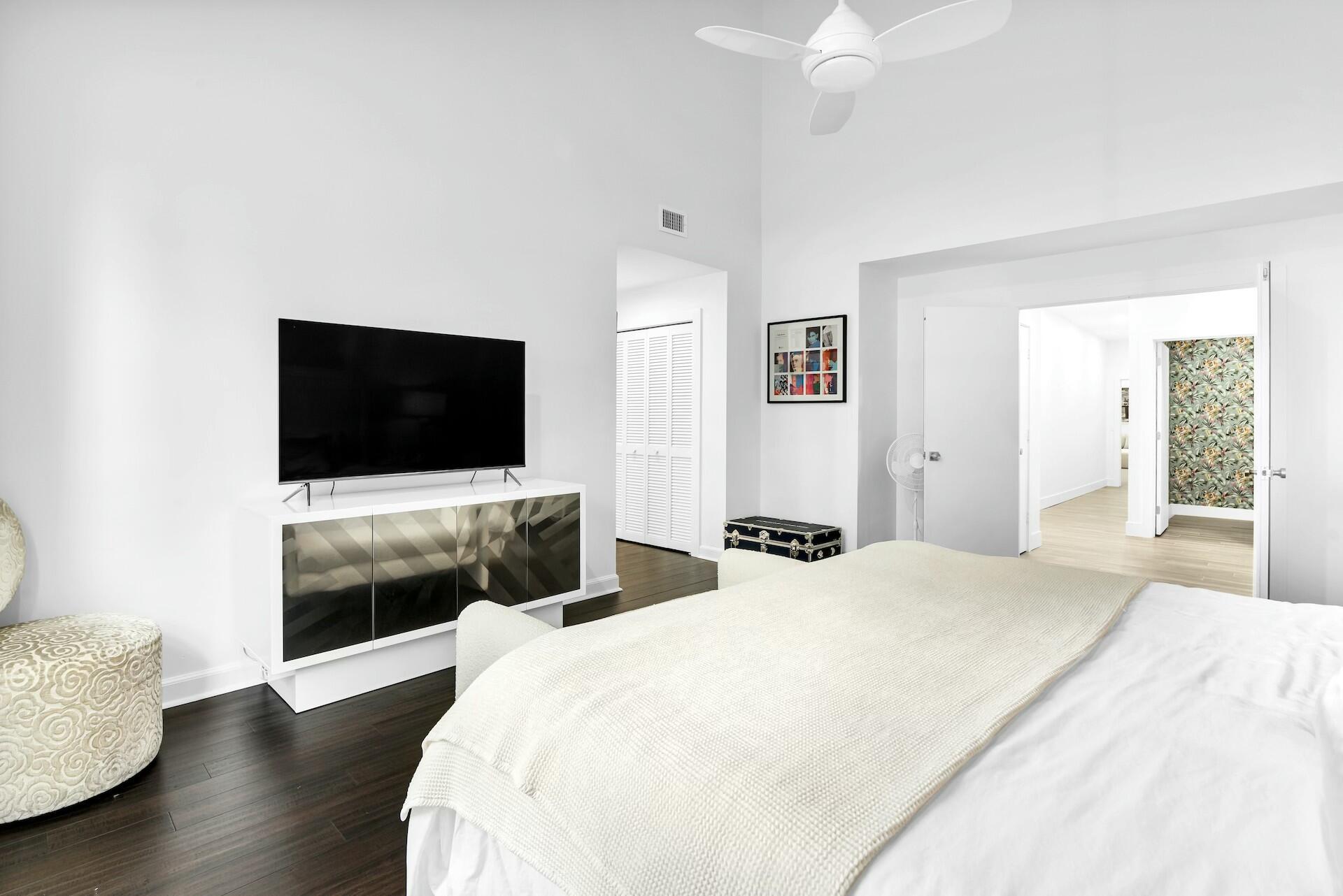 4356 Kasso Circle Boca Raton, FL 33487 - Photo 34 of 72 a bedroom with a bed and a flat screen tv