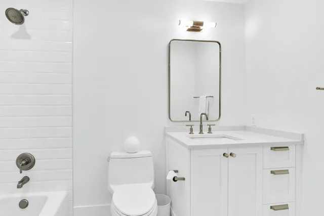 a view of a yard in front of a house with large trees