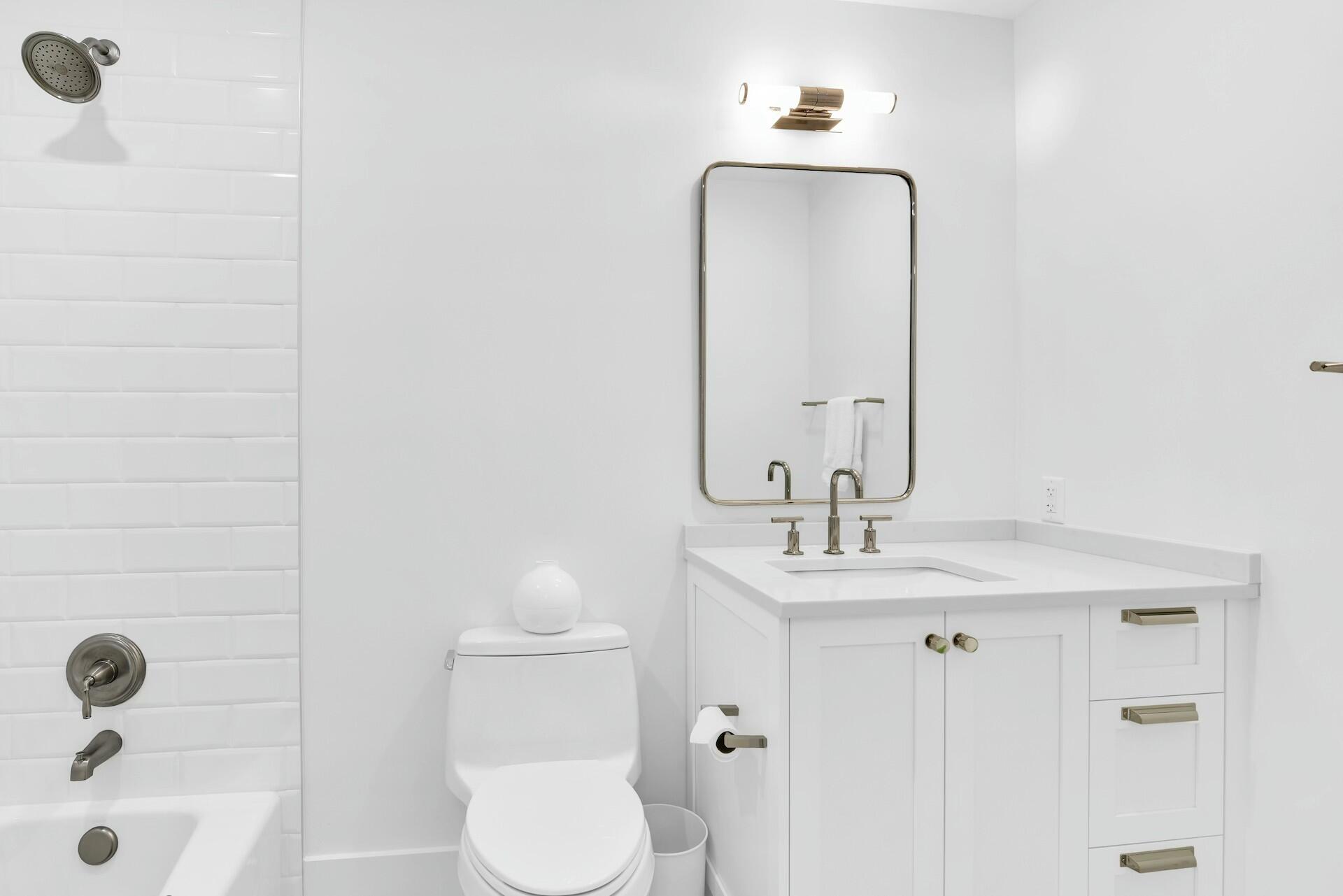 4356 Kasso Circle Boca Raton, FL 33487 - Photo 35 of 72 a bathroom with a sink a toilet and shower