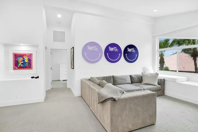 a view of a chairs and table in patio with a yard