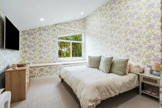 a view of a lake with a garden and entertaining space