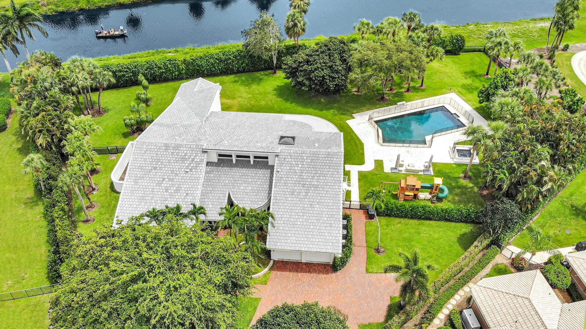4356 Kasso Circle Boca Raton, FL 33487 - Photo 50 of 72 an aerial view of a house with a garden and plants