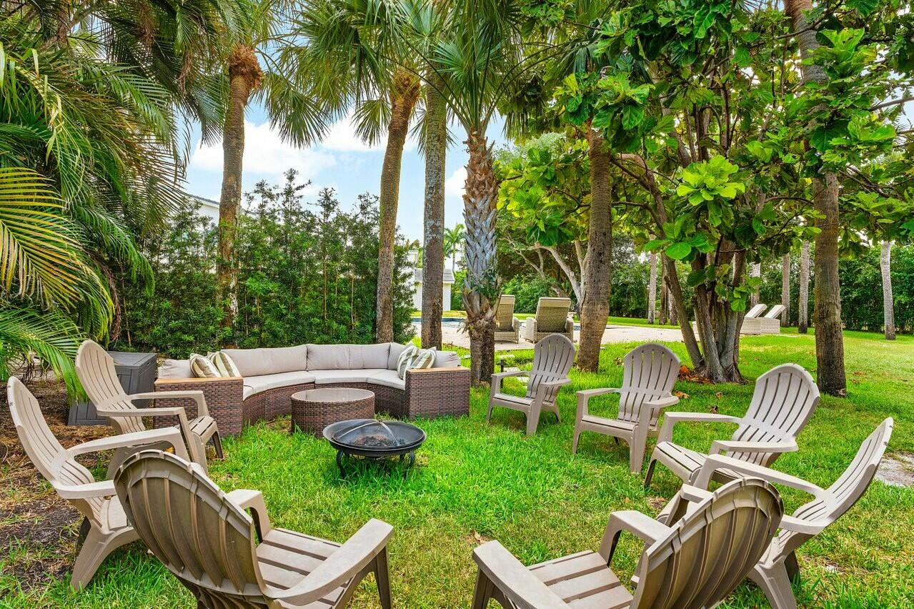 4356 Kasso Circle Boca Raton, FL 33487 - Photo 6 of 72 a view of a chair and tables in the backyard of a house