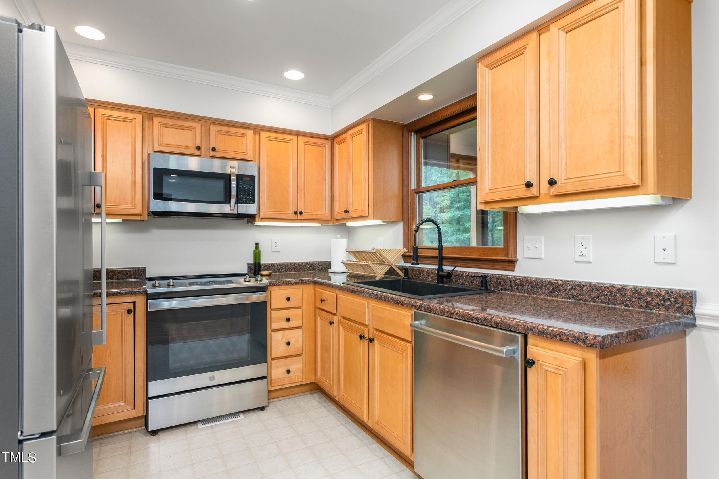8801 Highway 157 Rougemont, NC 27572 - Photo 10 of 60 a kitchen with stainless steel appliances granite countertop a stove microwave and sink