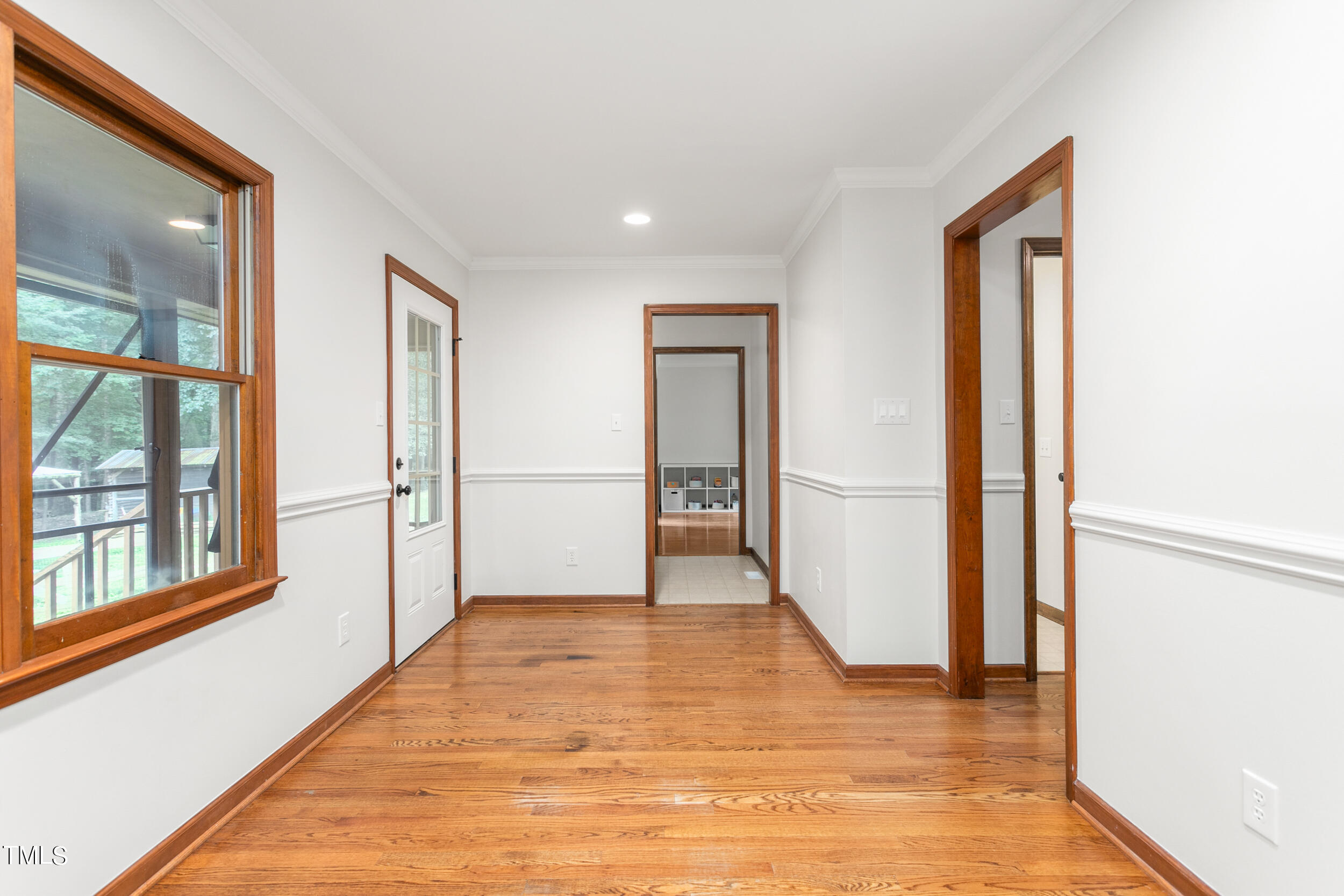 8801 Highway 157 Rougemont, NC 27572 - Photo 12 of 60 a view of an empty room with wooden floor and a window