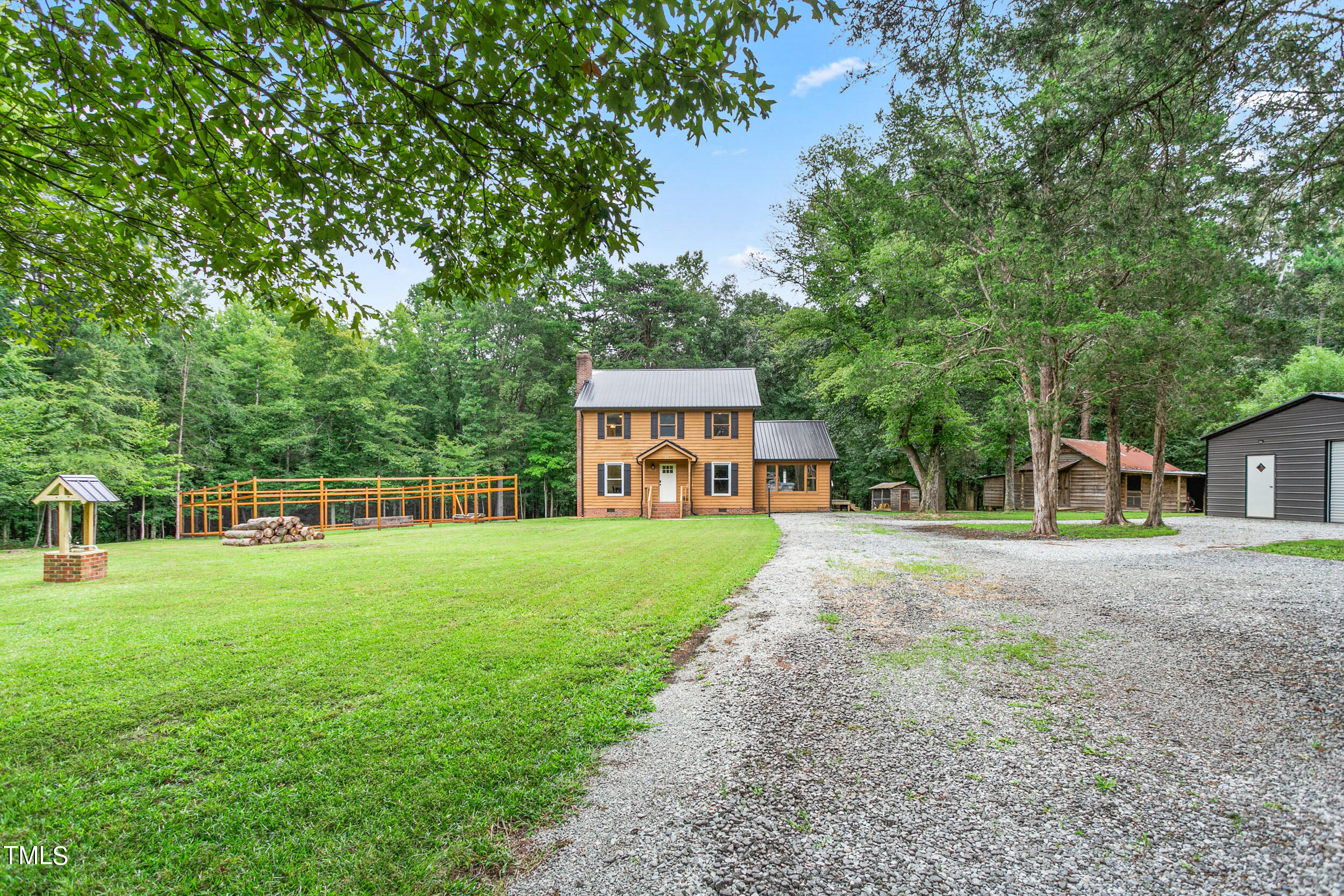 8801 Highway 157 Rougemont, NC 27572 - Photo 3 of 60 a view of a house with backyard and garden
