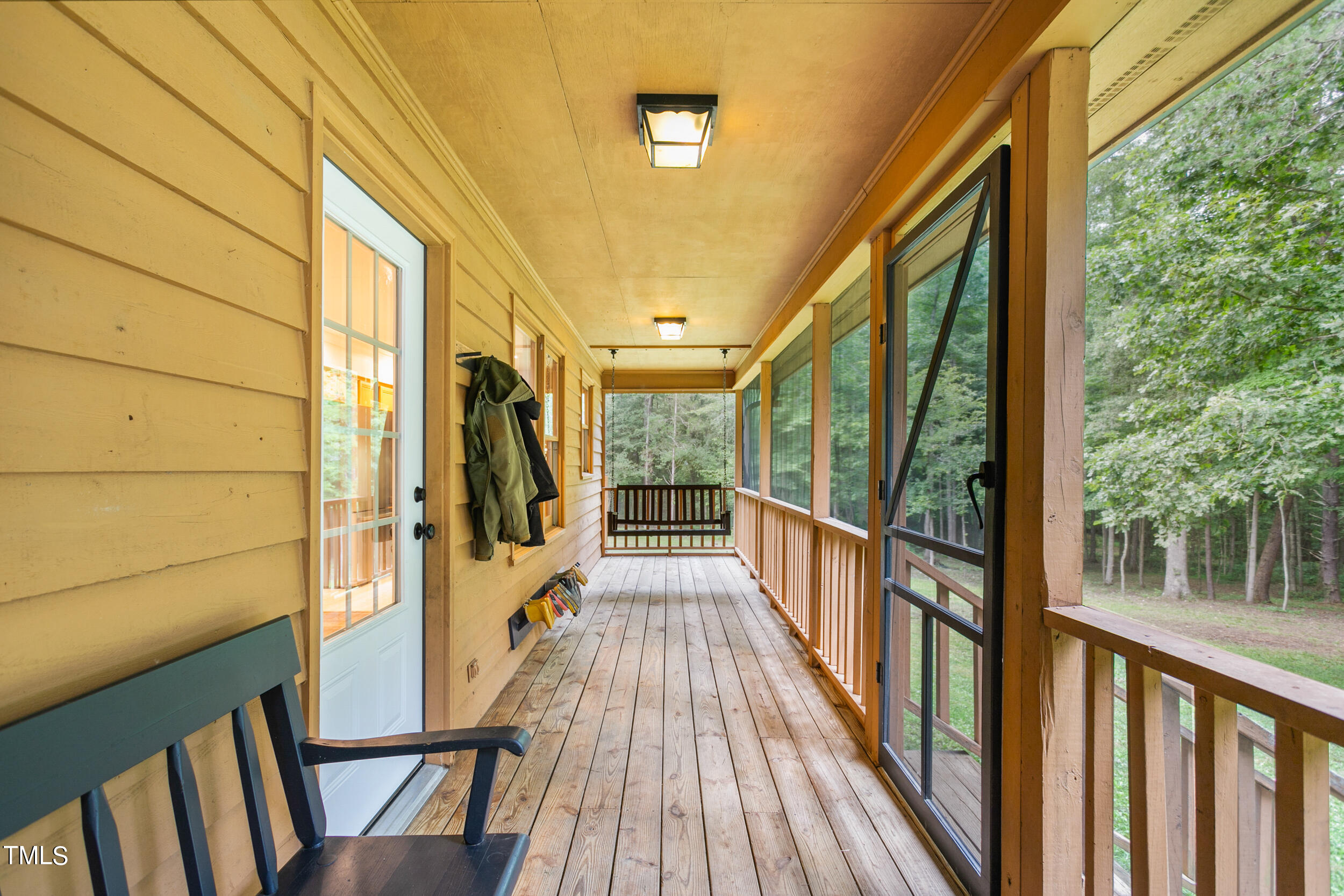 8801 Highway 157 Rougemont, NC 27572 - Photo 34 of 60 a view of balcony with wooden floor and floor to ceiling window