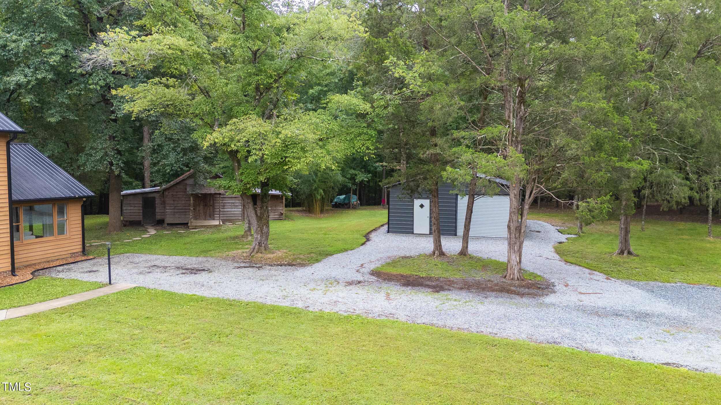 8801 Highway 157 Rougemont, NC 27572 - Photo 37 of 60 a front view of a house with a yard and tree