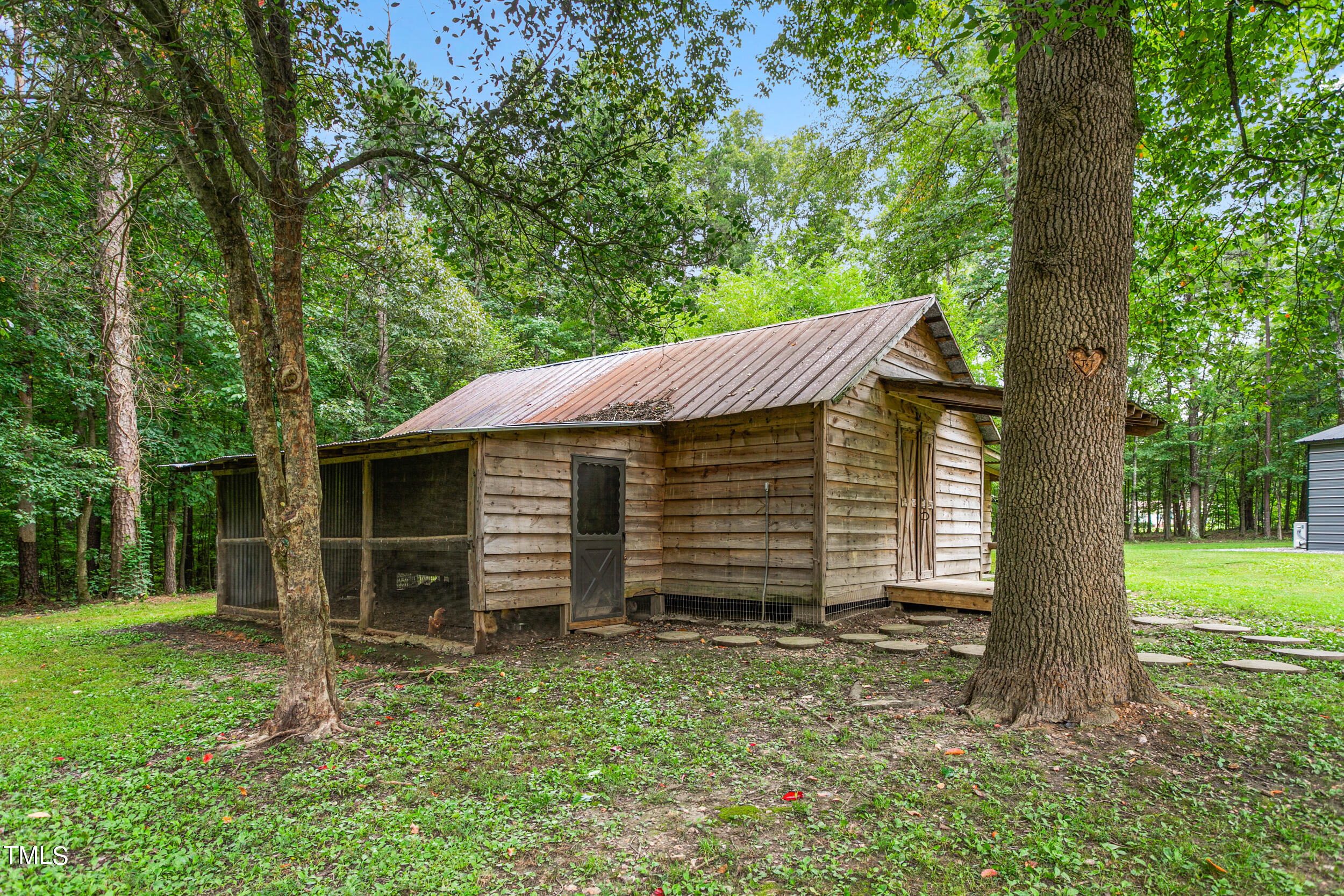 8801 Highway 157 Rougemont, NC 27572 - Photo 42 of 60 a view of a house with a yard