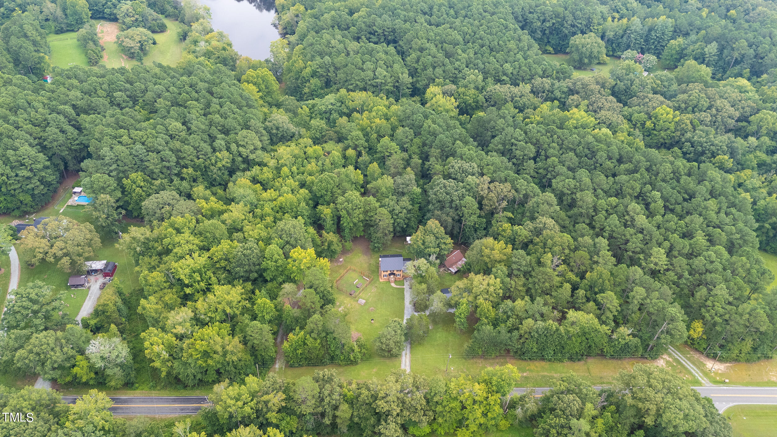 8801 Highway 157 Rougemont, NC 27572 - Photo 56 of 60 a view of a garden with a house