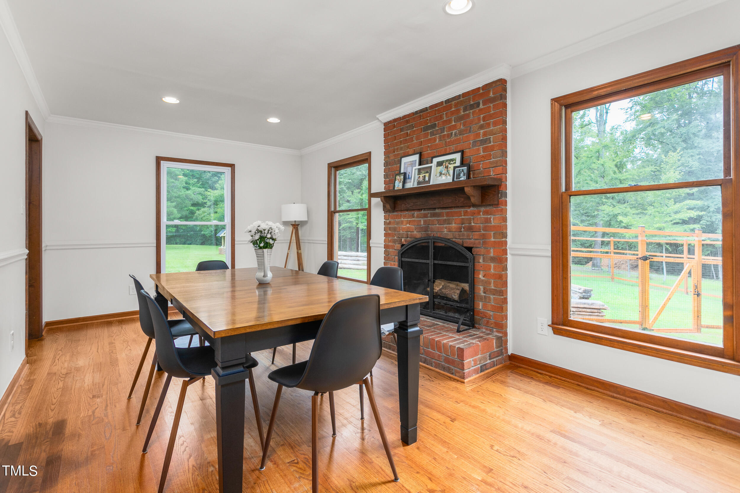 8801 Highway 157 Rougemont, NC 27572 - Photo 6 of 60 a dining room with furniture and a fireplace