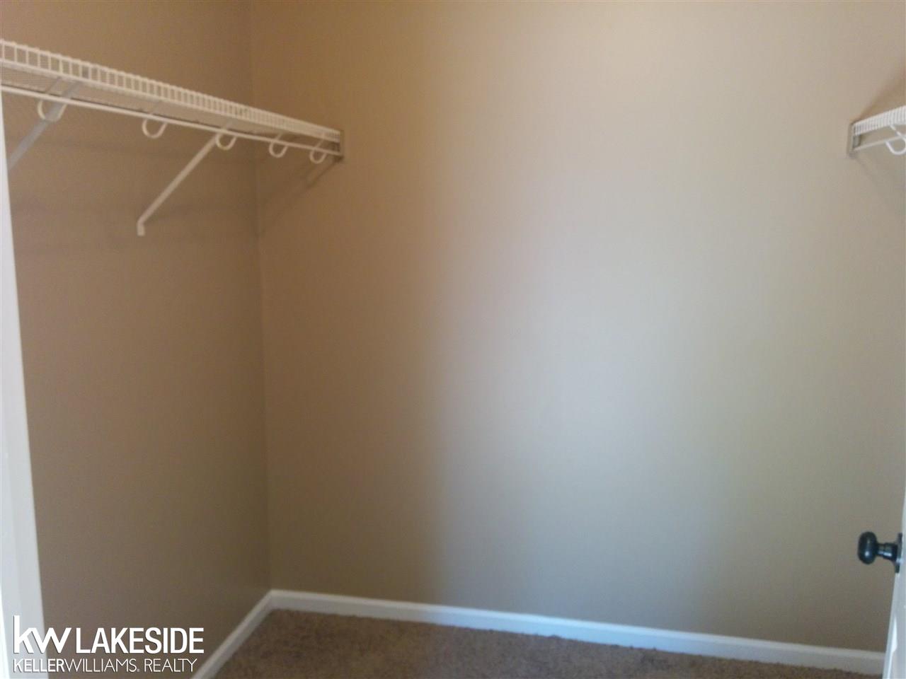 1782 Flagstone Circle Rochester, MI 48307 - Photo 15 of 21 Bedroom 2 has a large walk in closet.