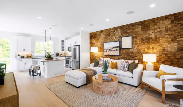 a living room with furniture and kitchen view