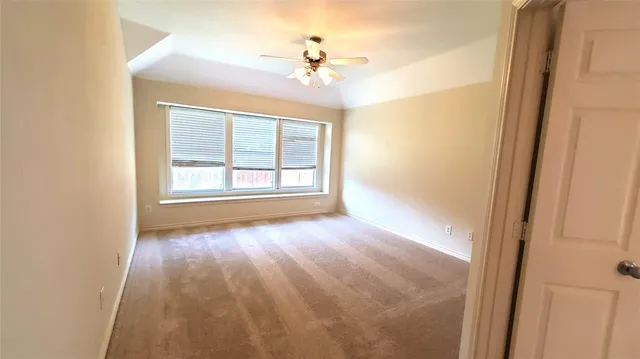 a view of a livingroom with a chandelier fan