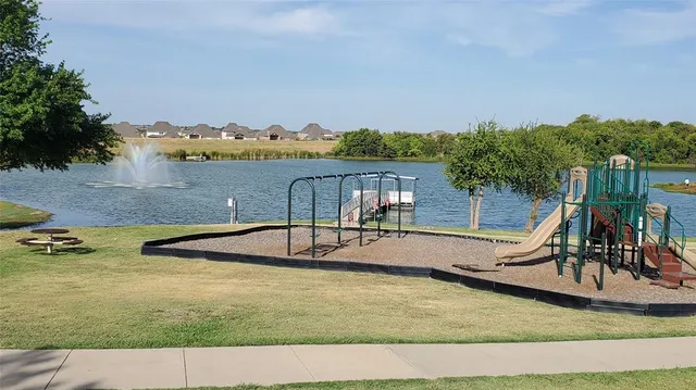 a view of a swimming pool with an outdoor space and seating area