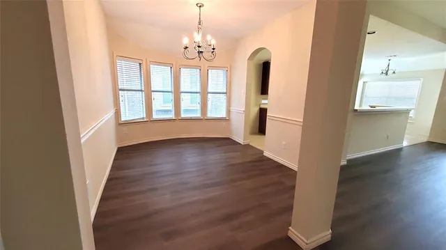 a view of a room with wooden floor and staircase