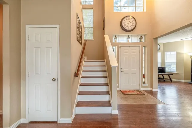 a view of an entryway with wooden floor