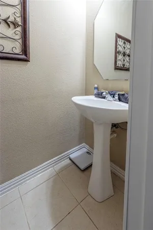 a bathroom with a sink and mirror