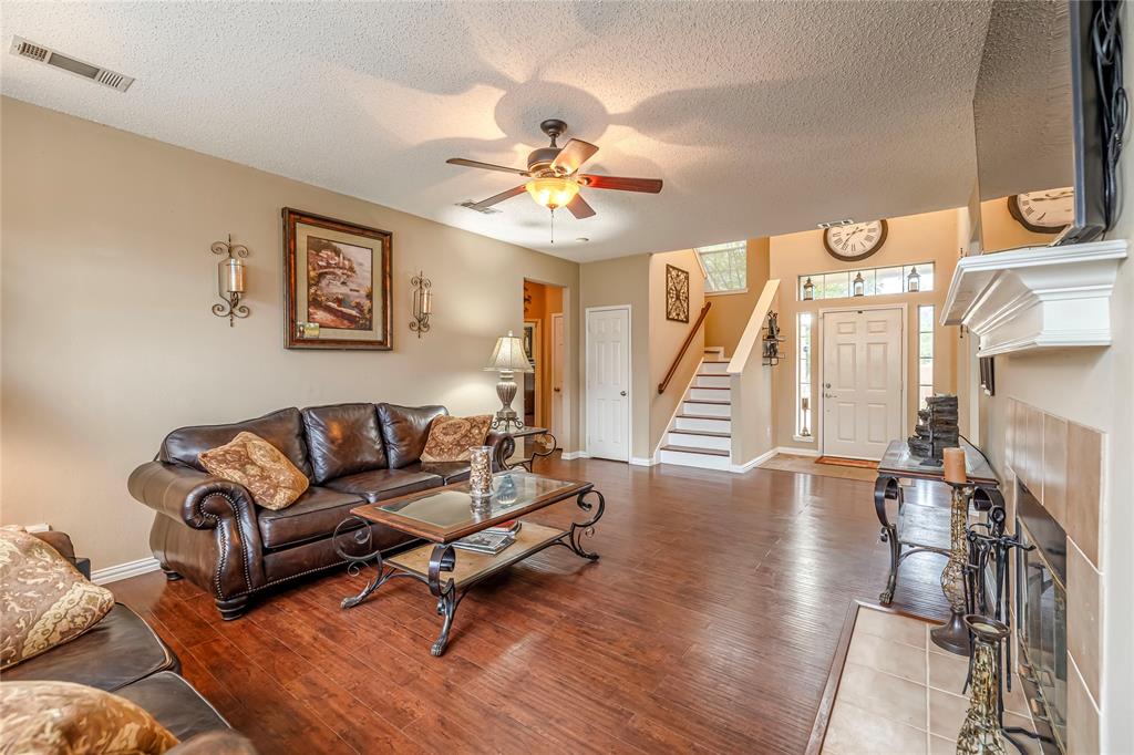 3103 Scott Drive Sachse, TX 75048 - Photo 8 of 26 a living room with furniture and a chandelier
