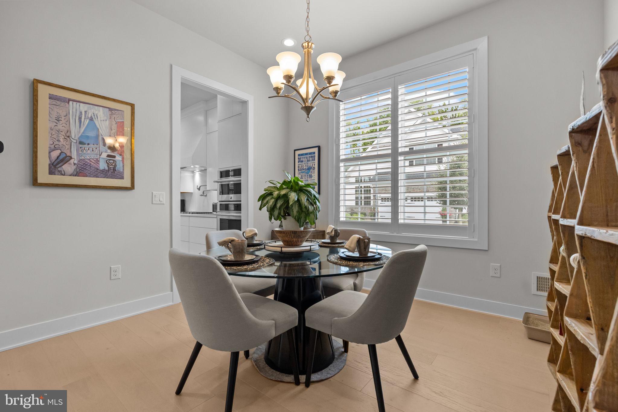 164 Tyler Way Yardley, PA 19067 - Photo 11 of 34 a dining room with furniture a large window and wooden floor