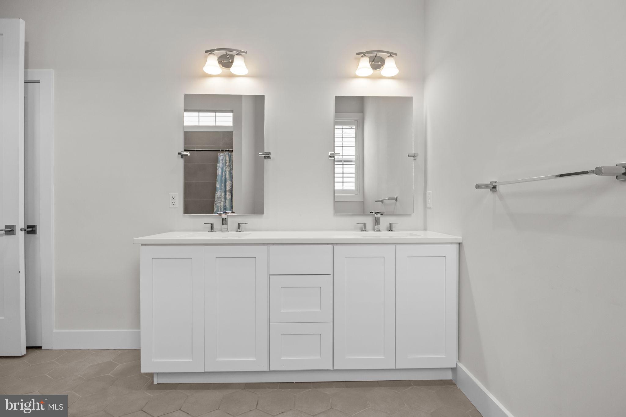 164 Tyler Way Yardley, PA 19067 - Photo 14 of 34 a bathroom with a double vanity sink and a mirror