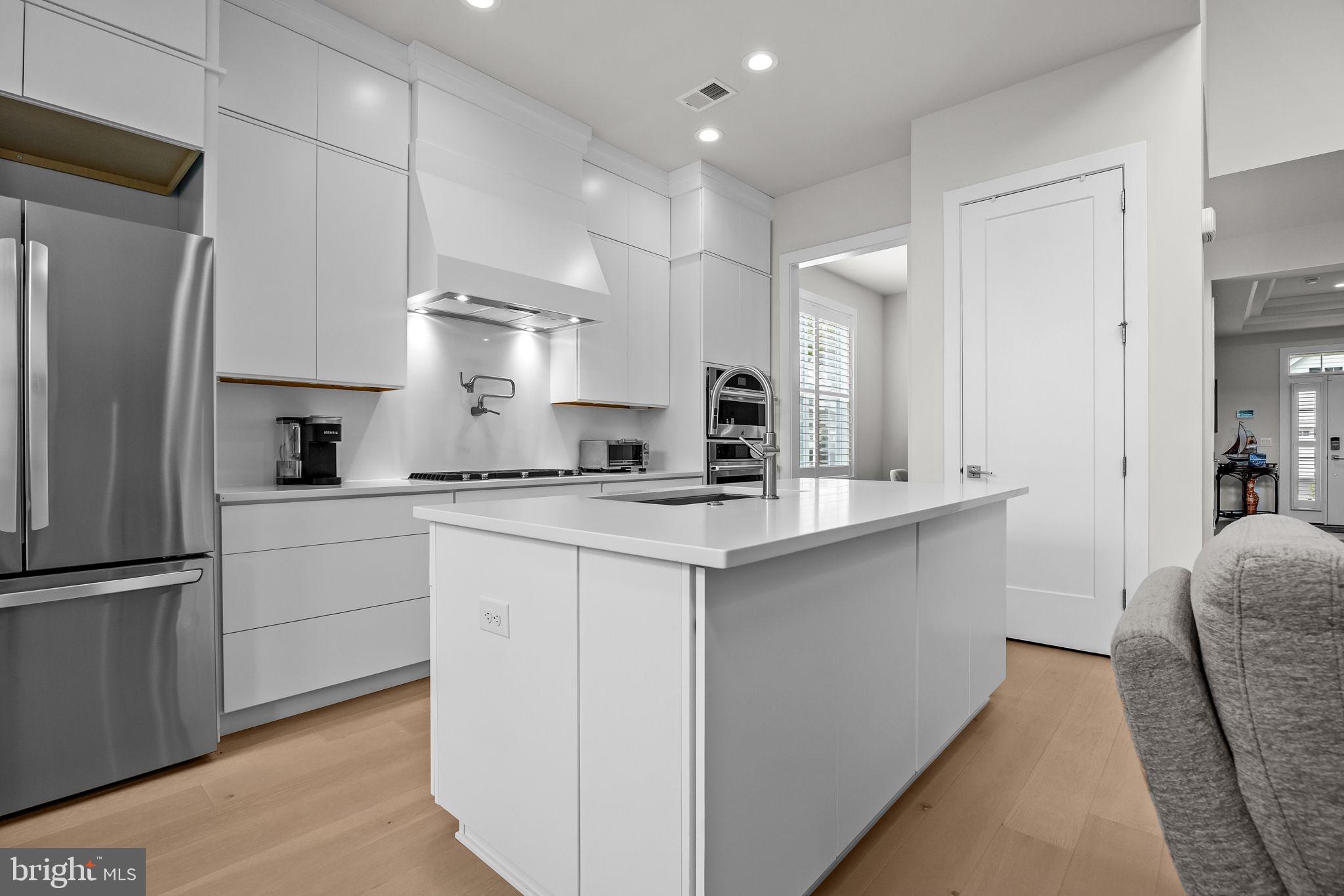 164 Tyler Way Yardley, PA 19067 - Photo 9 of 34 a kitchen with white cabinets and refrigerator