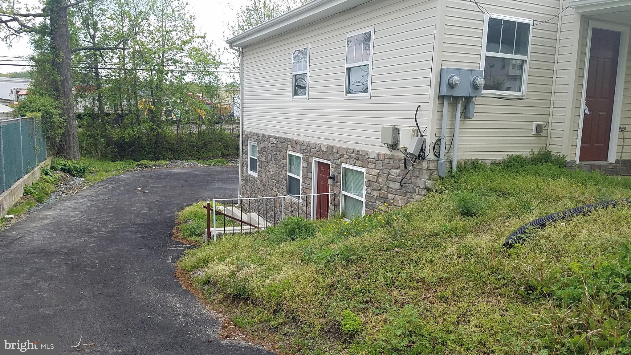 17746 Possum Point Road Dumfries, VA 22026 - Photo 6 of 25 Side entrance of unit B, lower level