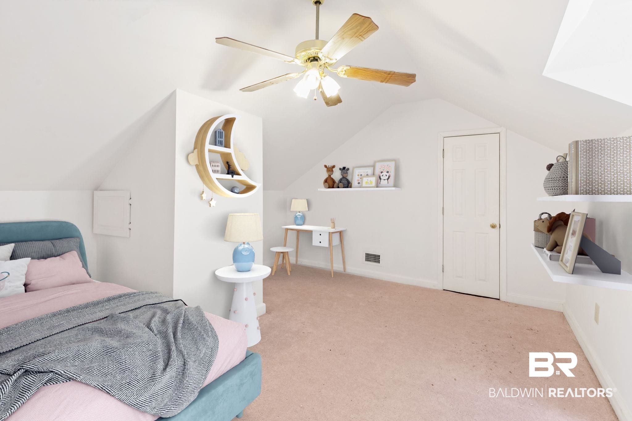 927 Cleveland Road Saraland, AL 36571 - Photo 44 of 77 Attic room featuring sloped ceilings, light-toned carpeting, a ceiling fan with integrated lighting, a paneled door, and built-in shelving