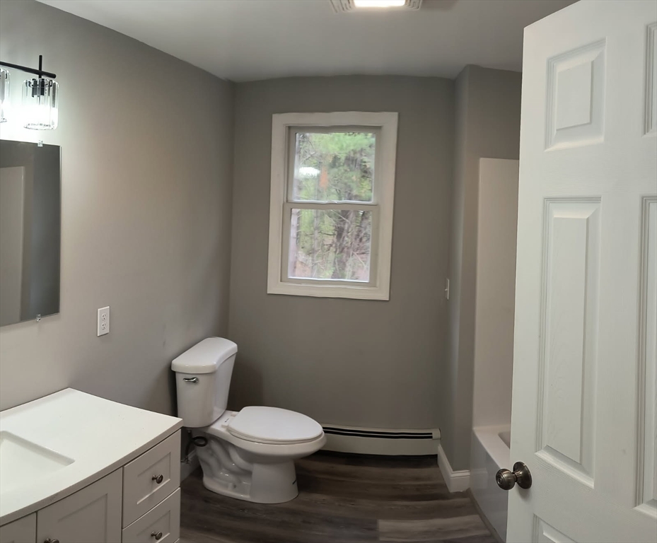 713 Holyoke Road Westfield, MA 01085 - Photo 16 of 22 a white toilet sitting next to a bathroom sink