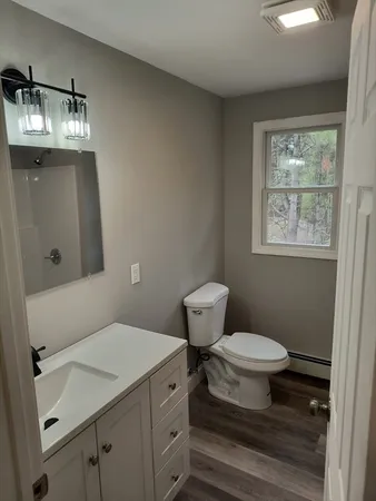 a view of wooden floor in a white building