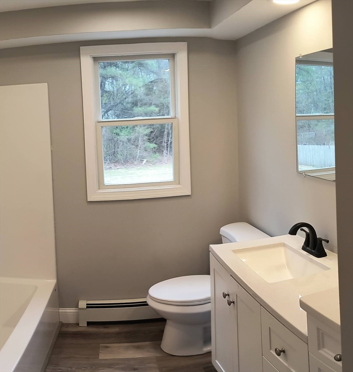 713 Holyoke Road Westfield, MA 01085 - Photo 10 of 22 a bathroom with a sink a toilet and a window