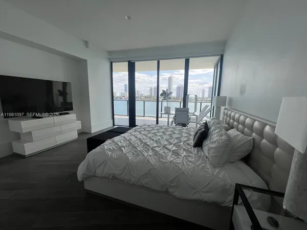 a bathroom with a sink shower and a toilet